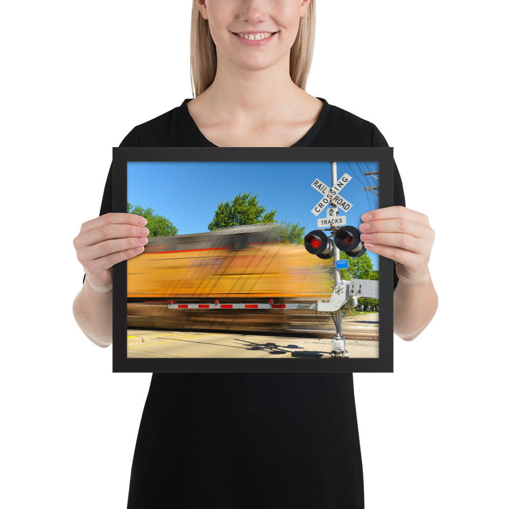 Freight Train Roaring Through an Active Railroad Crossing - Framed Print