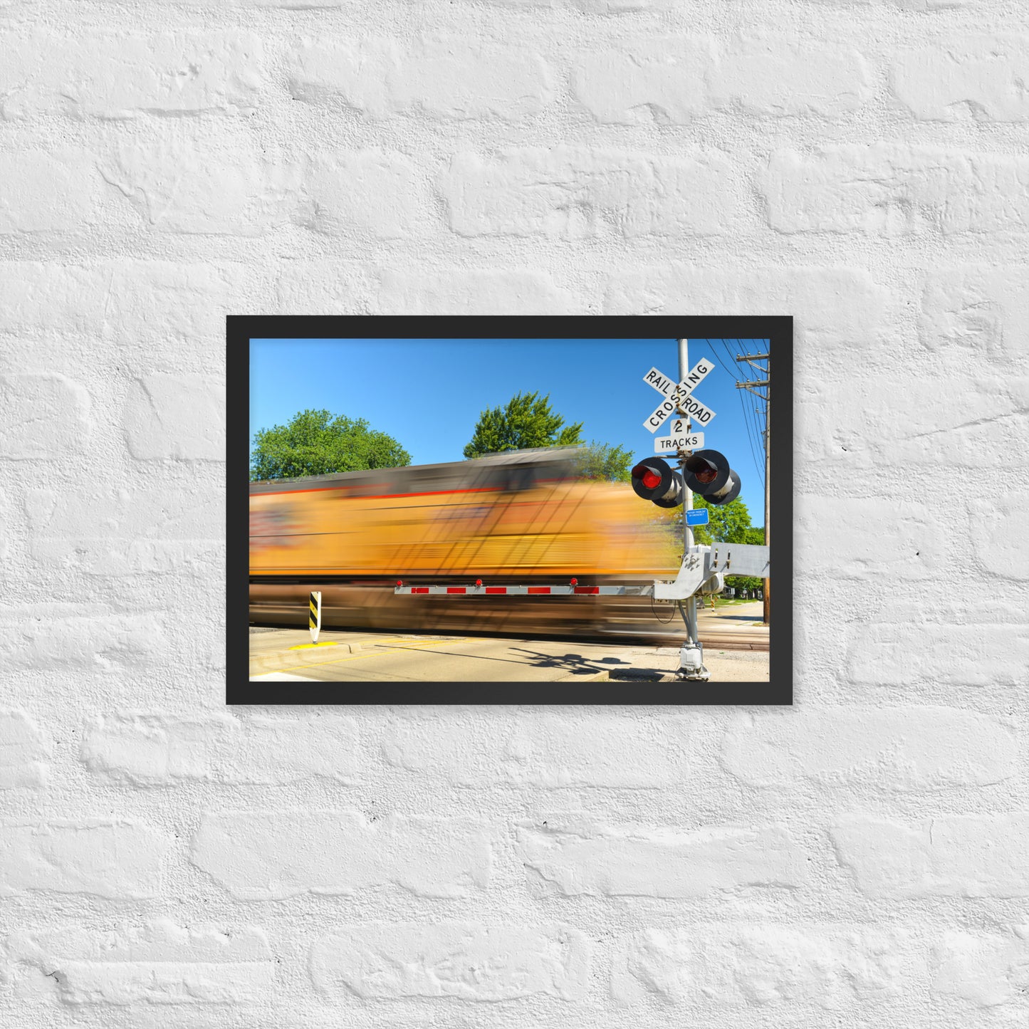 Freight Train Roaring Through an Active Railroad Crossing - Framed Print