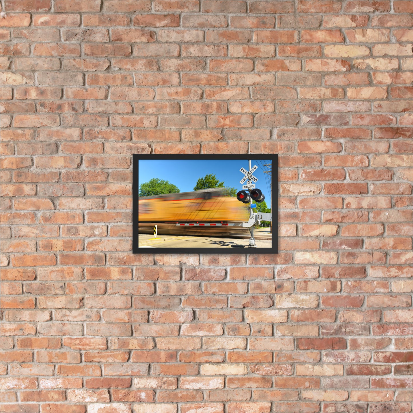 Freight Train Roaring Through an Active Railroad Crossing - Framed Print