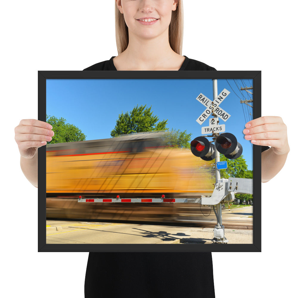 Freight Train Roaring Through an Active Railroad Crossing - Framed Print