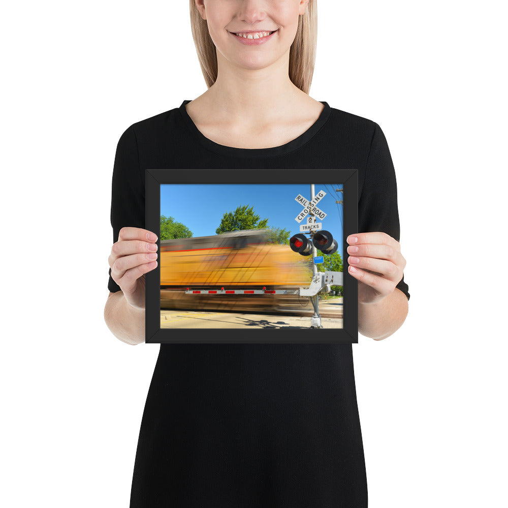 Freight Train Roaring Through an Active Railroad Crossing - Framed Print