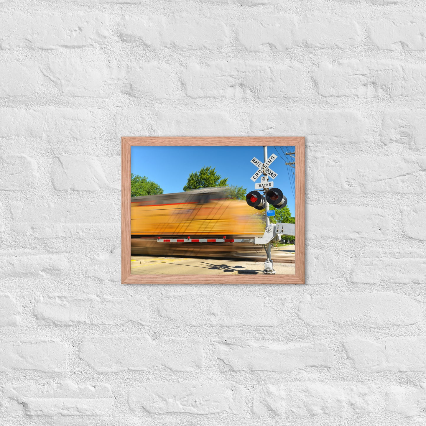 Freight Train Roaring Through an Active Railroad Crossing - Framed Print