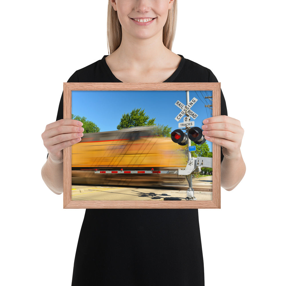 Freight Train Roaring Through an Active Railroad Crossing - Framed Print