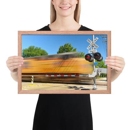 Freight Train Roaring Through an Active Railroad Crossing - Framed Print