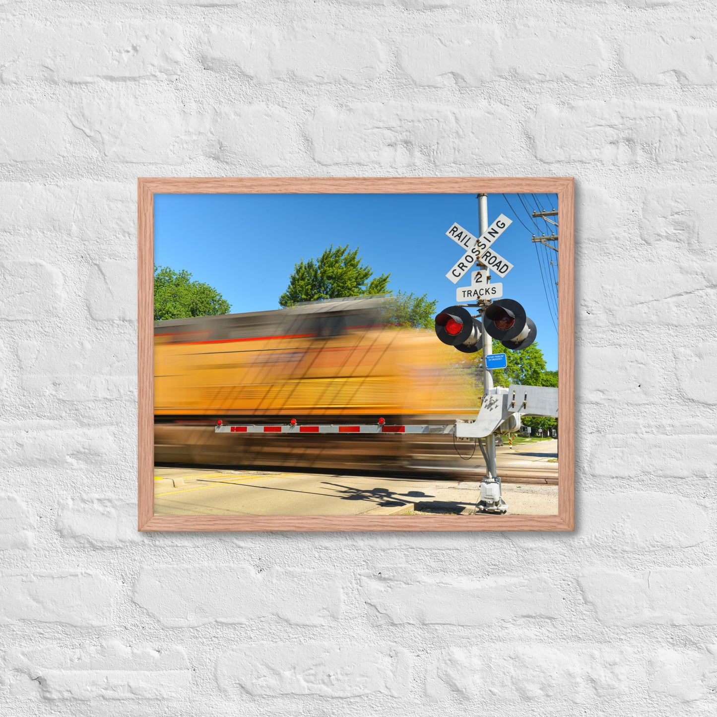 Freight Train Roaring Through an Active Railroad Crossing - Framed Print