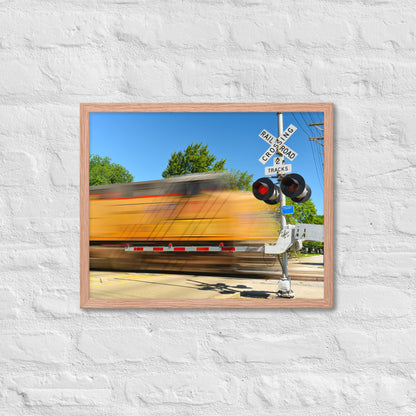 Freight Train Roaring Through an Active Railroad Crossing - Framed Print