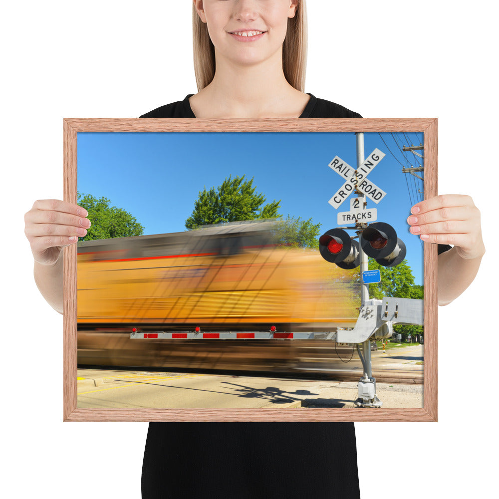 Freight Train Roaring Through an Active Railroad Crossing - Framed Print