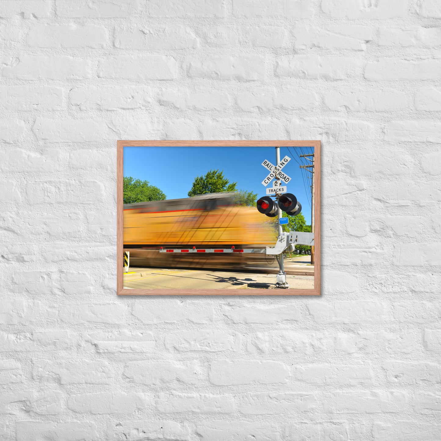 Freight Train Roaring Through an Active Railroad Crossing - Framed Print