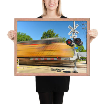 Freight Train Roaring Through an Active Railroad Crossing - Framed Print