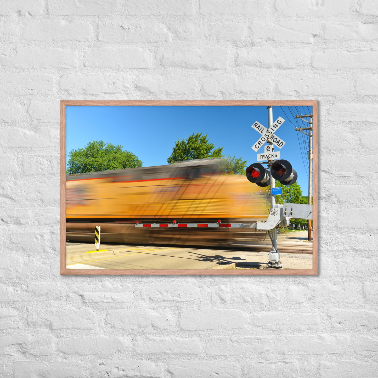 Freight Train Roaring Through an Active Railroad Crossing - Framed Print