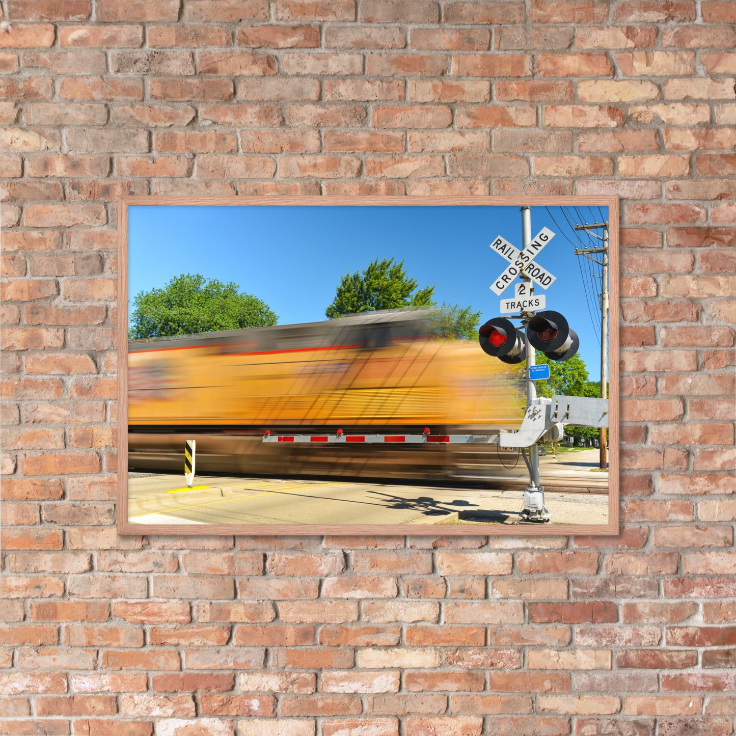 Freight Train Roaring Through an Active Railroad Crossing - Framed Print