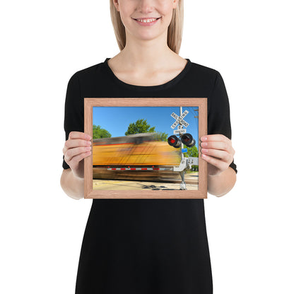 Freight Train Roaring Through an Active Railroad Crossing - Framed Print