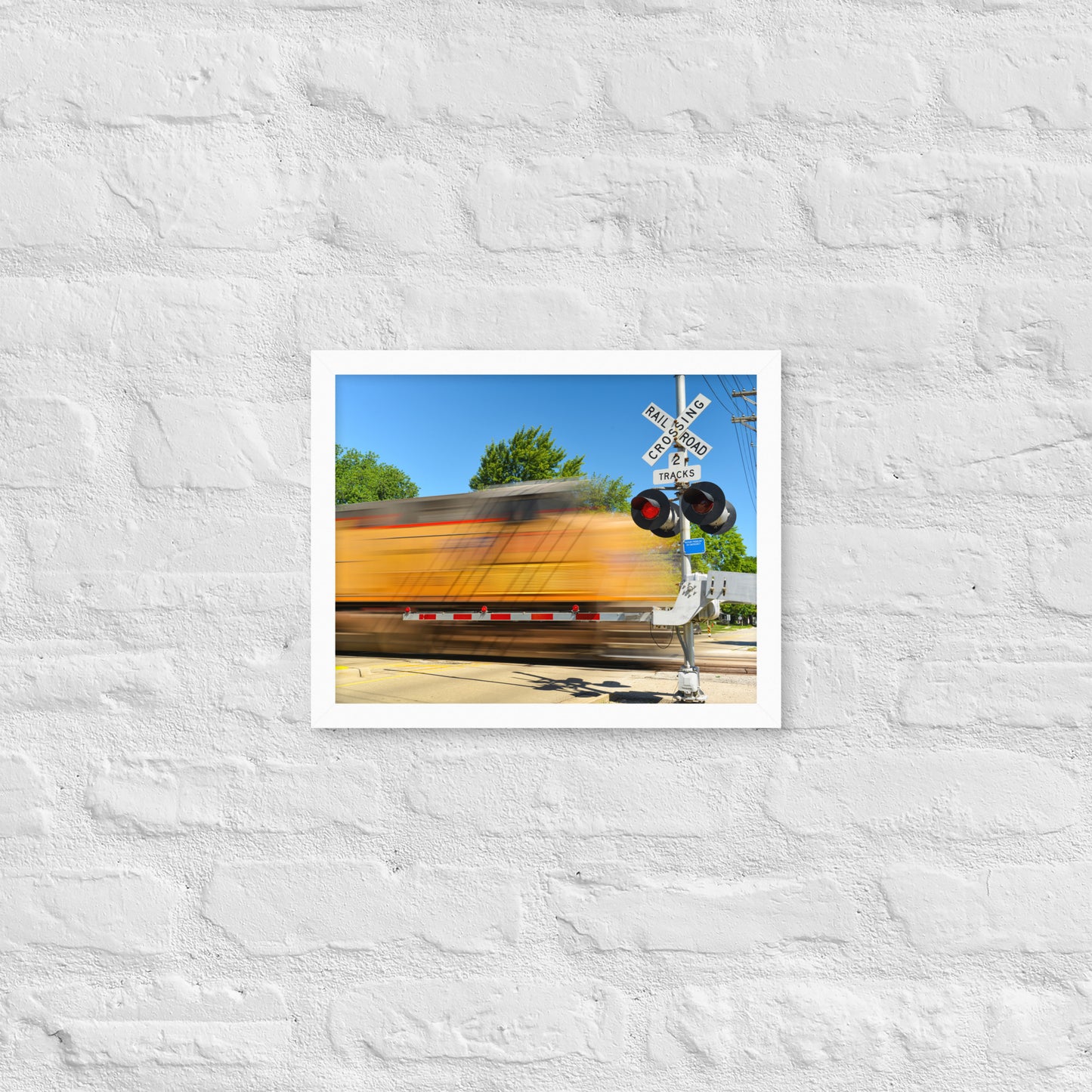 Freight Train Roaring Through an Active Railroad Crossing - Framed Print