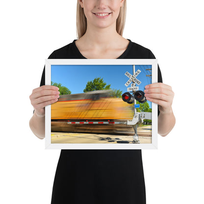 Freight Train Roaring Through an Active Railroad Crossing - Framed Print