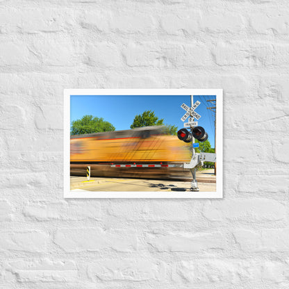 Freight Train Roaring Through an Active Railroad Crossing - Framed Print