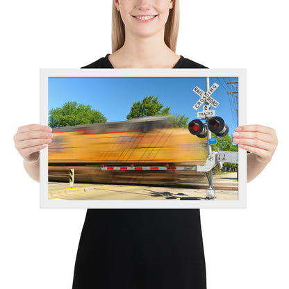 Freight Train Roaring Through an Active Railroad Crossing - Framed Print