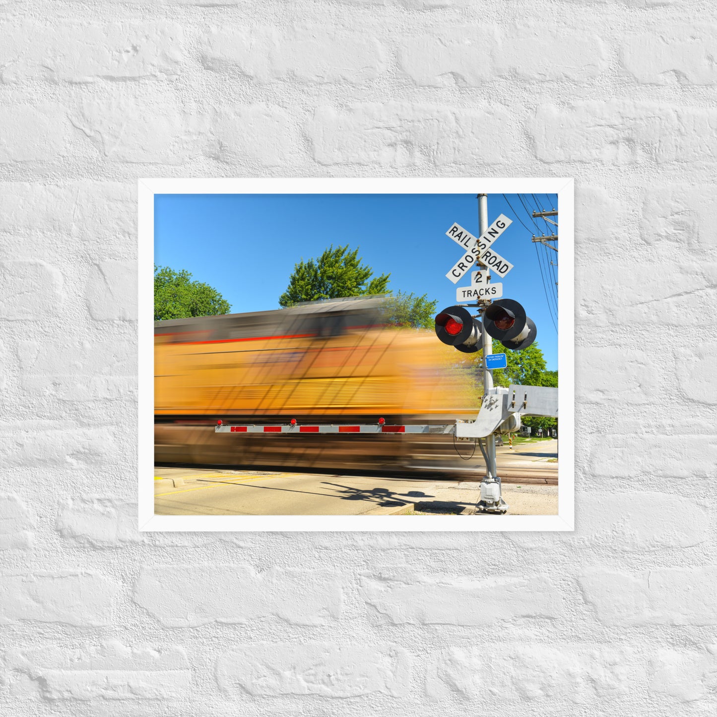 Freight Train Roaring Through an Active Railroad Crossing - Framed Print