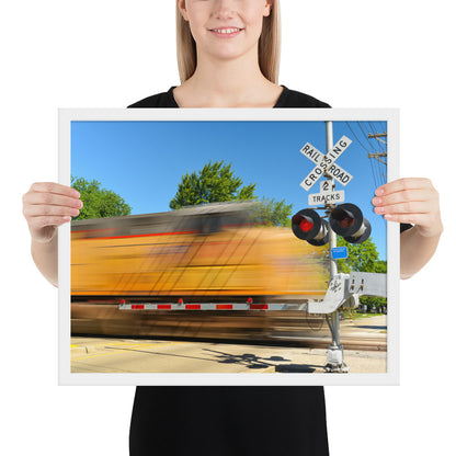 Freight Train Roaring Through an Active Railroad Crossing - Framed Print