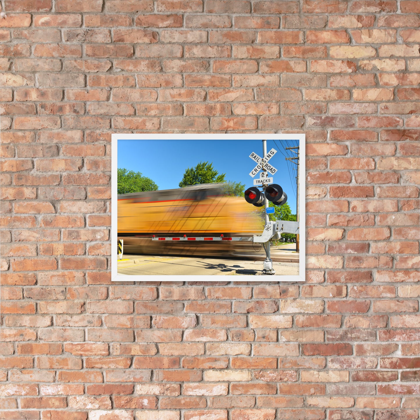 Freight Train Roaring Through an Active Railroad Crossing - Framed Print