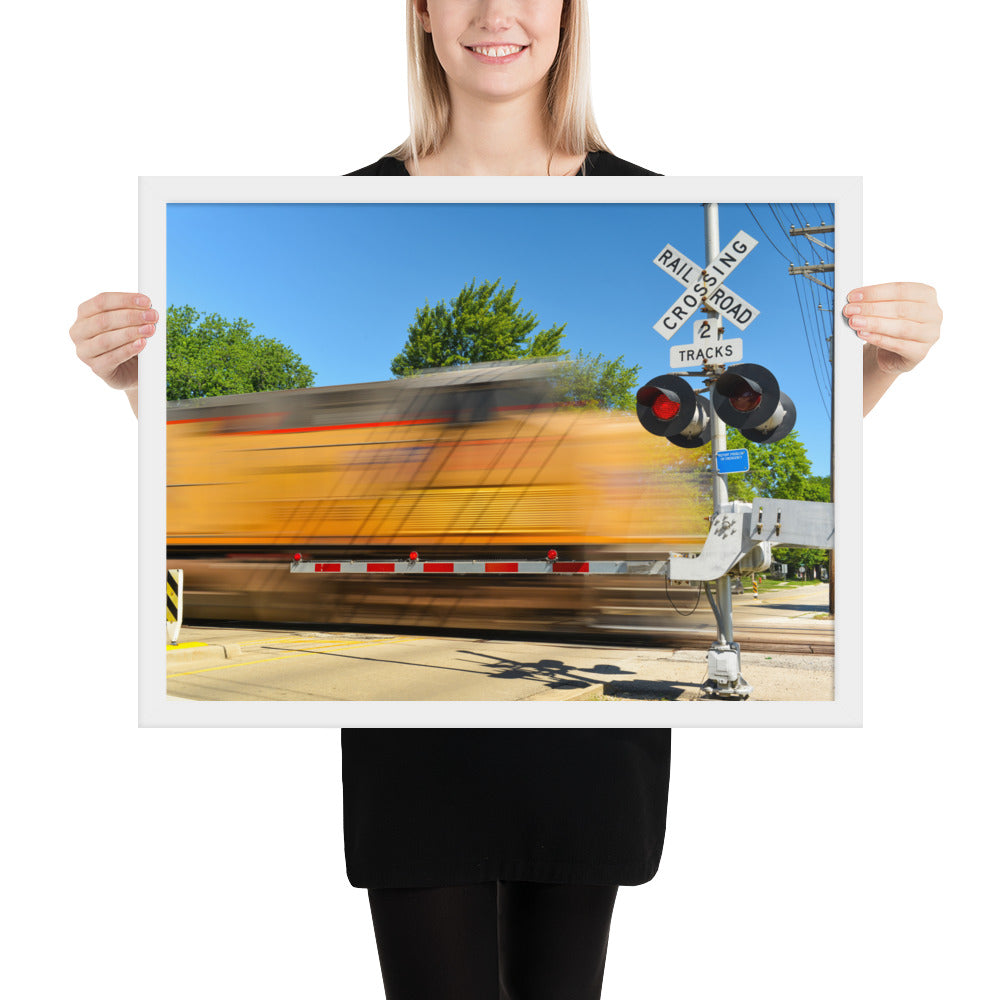 Freight Train Roaring Through an Active Railroad Crossing - Framed Print