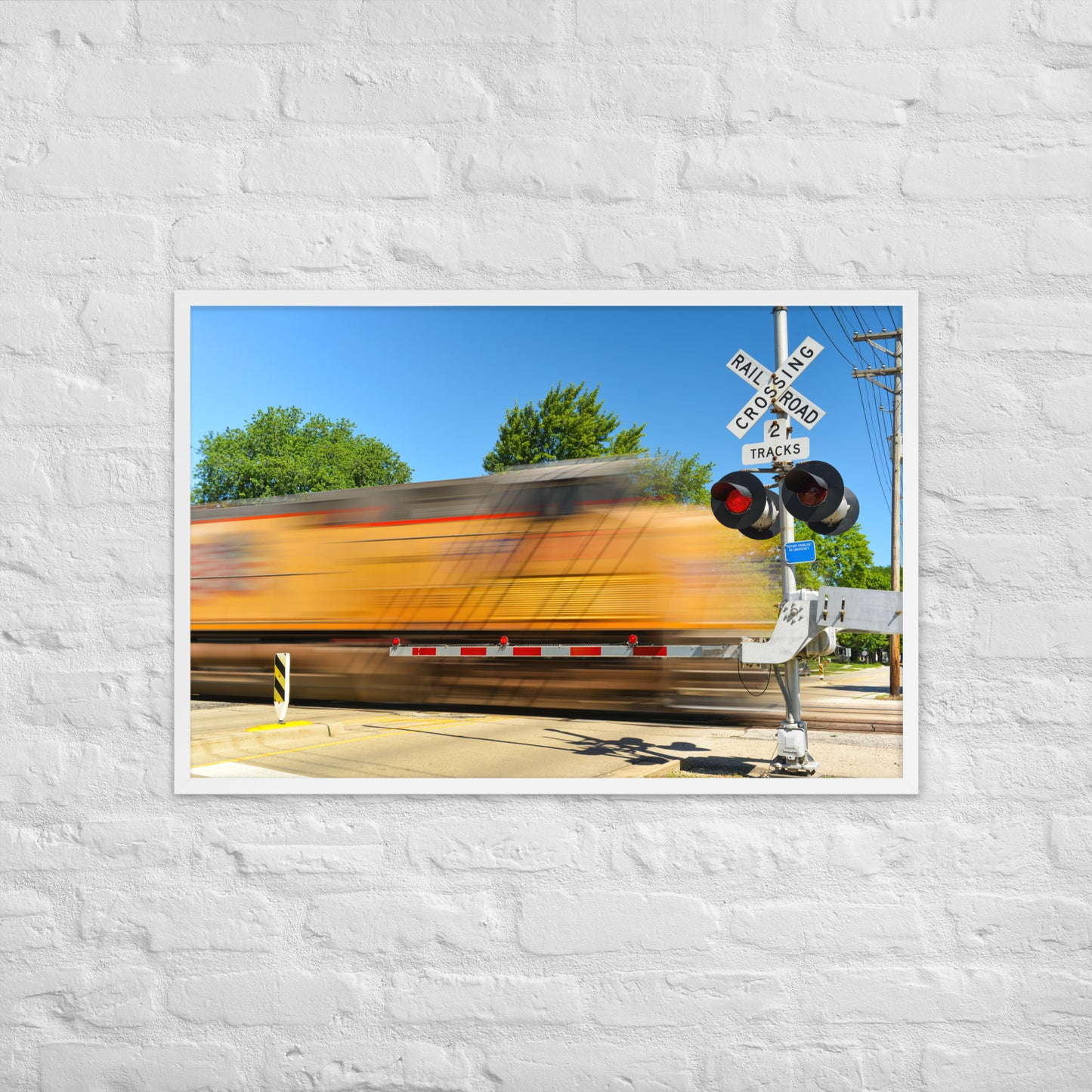 Freight Train Roaring Through an Active Railroad Crossing - Framed Print