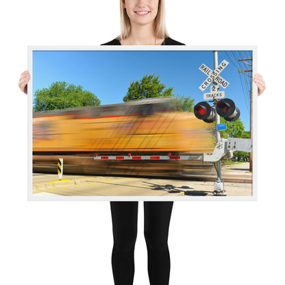 Freight Train Roaring Through an Active Railroad Crossing - Framed Print