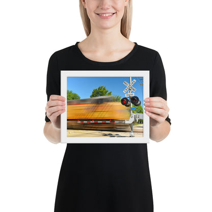 Freight Train Roaring Through an Active Railroad Crossing - Framed Print