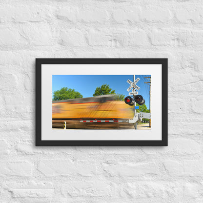 Freight Train Roaring Through an Active Railroad Crossing - Framed Print