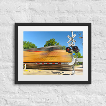 Freight Train Roaring Through an Active Railroad Crossing - Framed Print