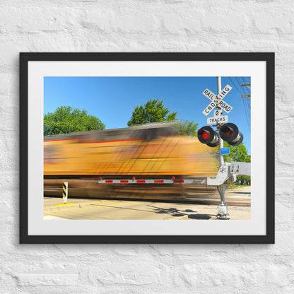 Freight Train Roaring Through an Active Railroad Crossing - Framed Print