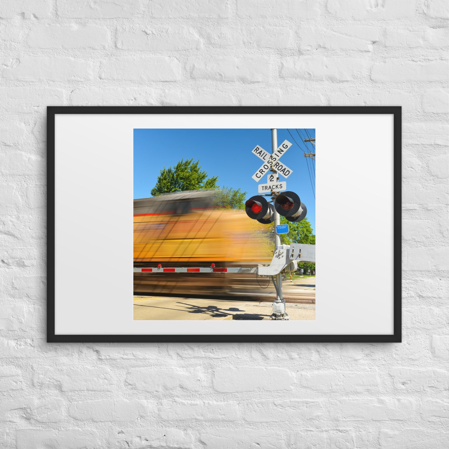 Freight Train Roaring Through an Active Railroad Crossing - Framed Print