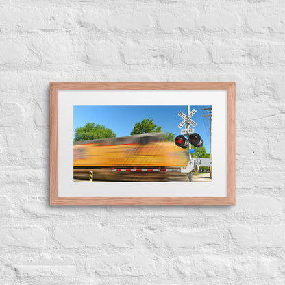 Freight Train Roaring Through an Active Railroad Crossing - Framed Print