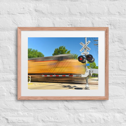 Freight Train Roaring Through an Active Railroad Crossing - Framed Print