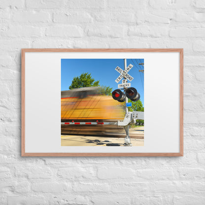 Freight Train Roaring Through an Active Railroad Crossing - Framed Print