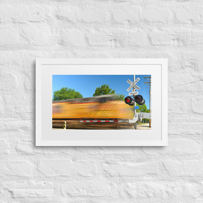 Freight Train Roaring Through an Active Railroad Crossing - Framed Print