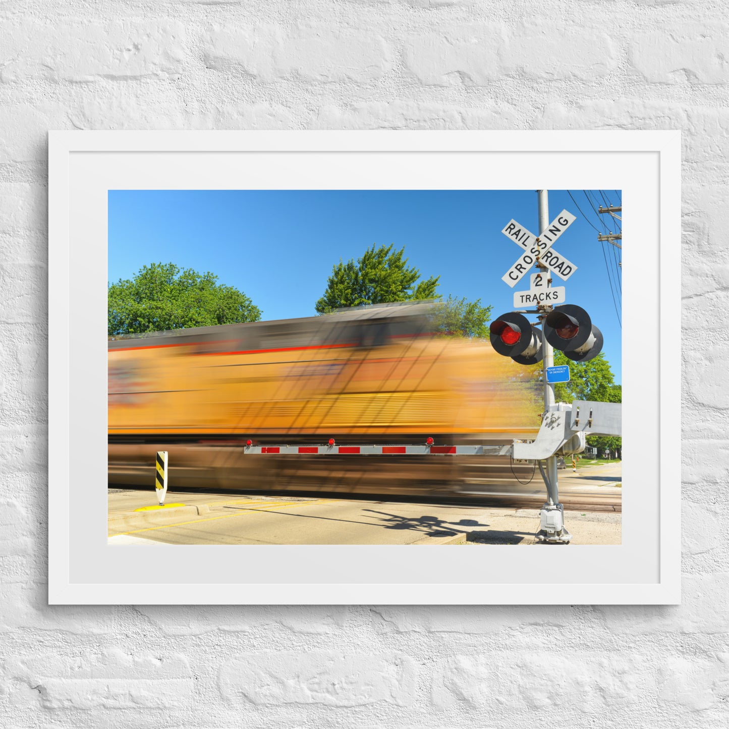 Freight Train Roaring Through an Active Railroad Crossing - Framed Print