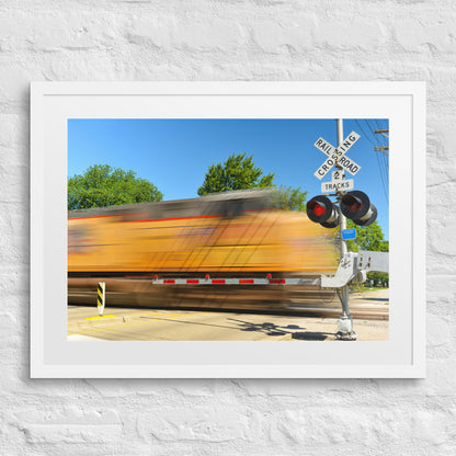 Freight Train Roaring Through an Active Railroad Crossing - Framed Print