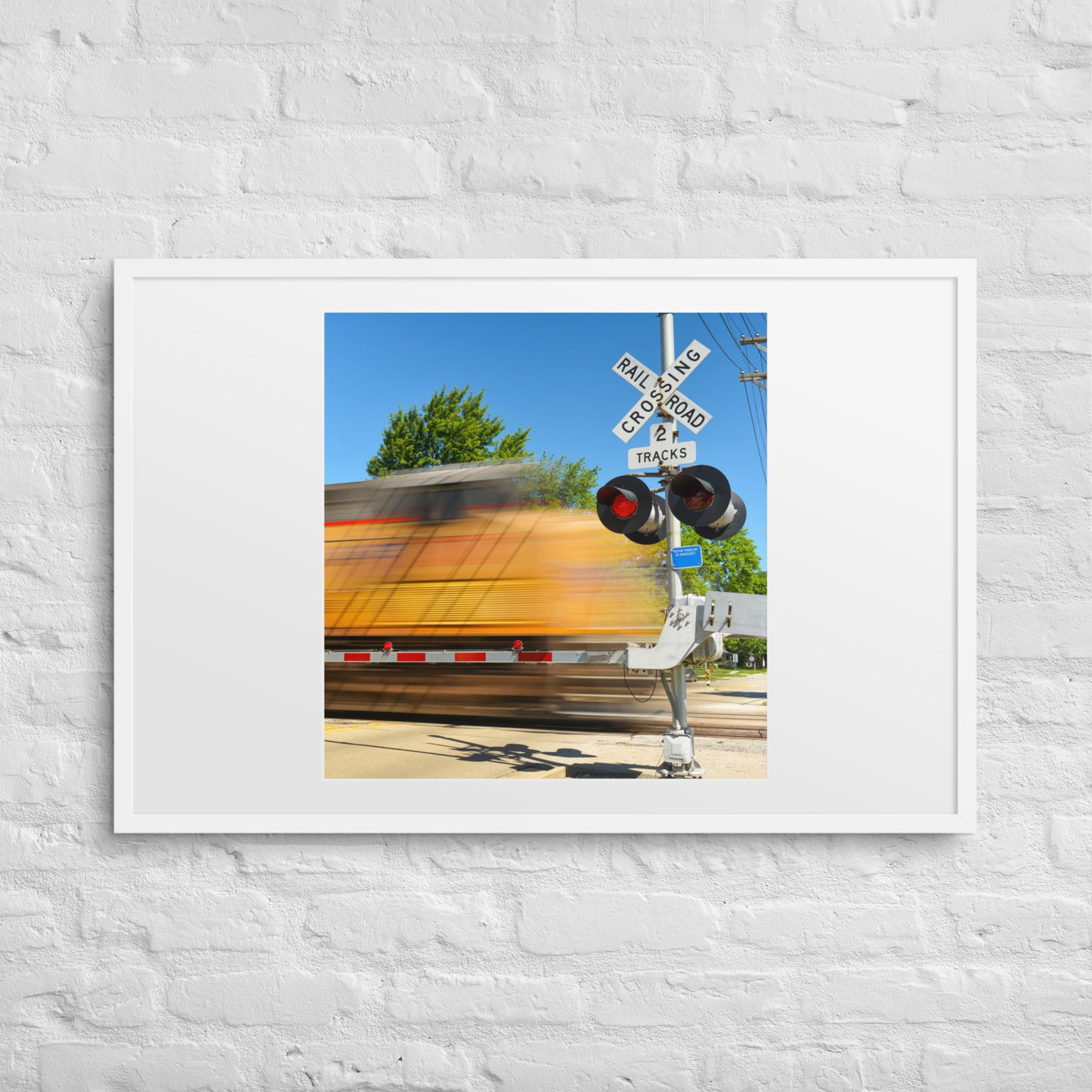 Freight Train Roaring Through an Active Railroad Crossing - Framed Print